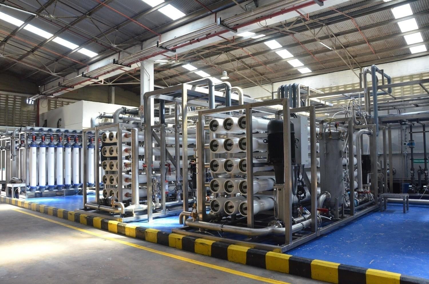 Ultrafiltration modules and RO pressure-vessel skids in a membrane hall